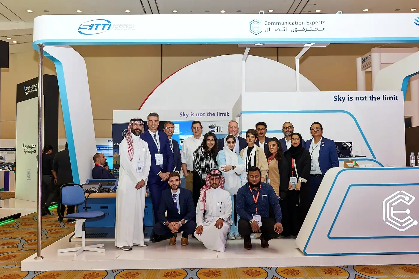 People gathered on the Communication Experts stand at an industry exhibition